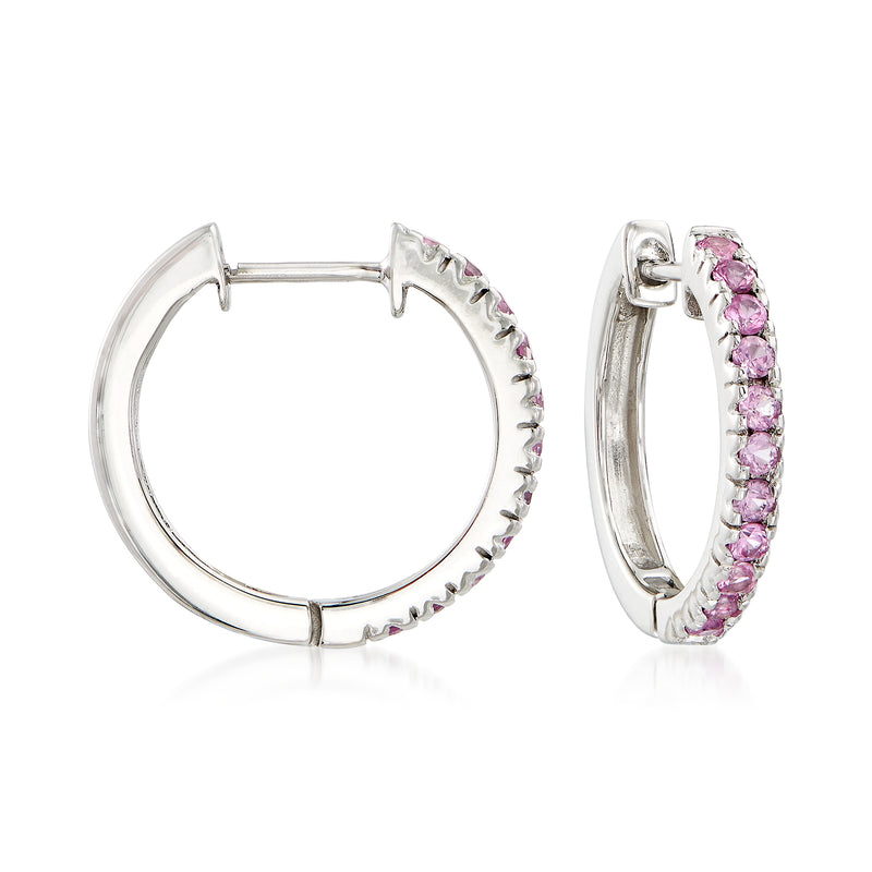 Sterling silver hoop earrings with pink sapphire stones along the hoop