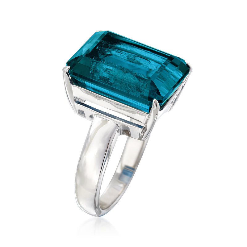 Sterling silver ring with rectangular blue topaz gemstone, angled view