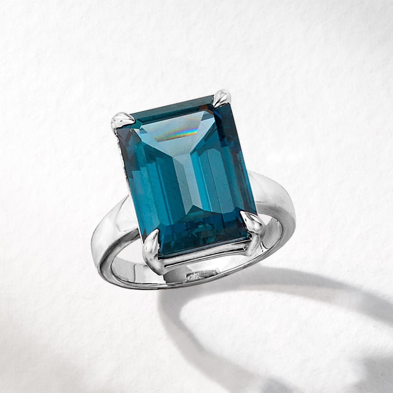 Sterling silver ring with emerald-cut London blue topaz, four-prong mount