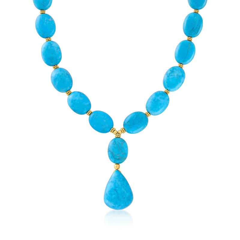 Blue howlite bead necklace with gold-tone links and a teardrop centerpiece