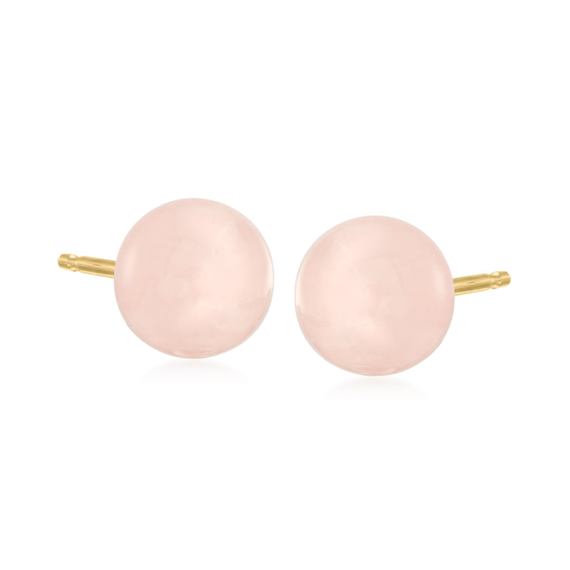 Round pink quartz stud earrings in 14kt yellow gold, gold posts visible
