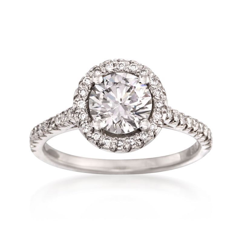 Platinum diamond engagement ring with round center stone and halo