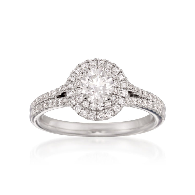 18kt white gold halo engagement ring with round center diamond and pave band