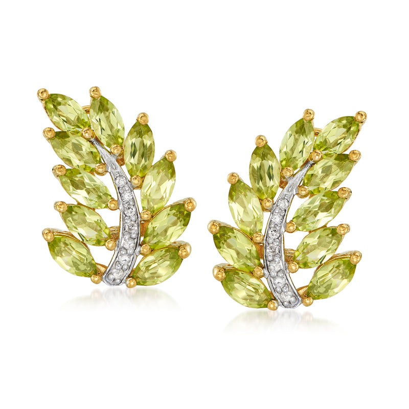 Gold leaf stud earrings with peridot-green stones and clear diamond accents