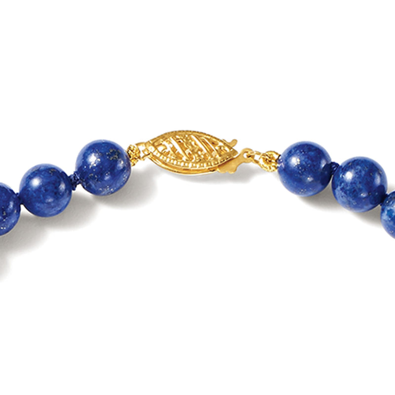Close-up: lapis bead necklace with 14kt yellow gold leaf-style clasp