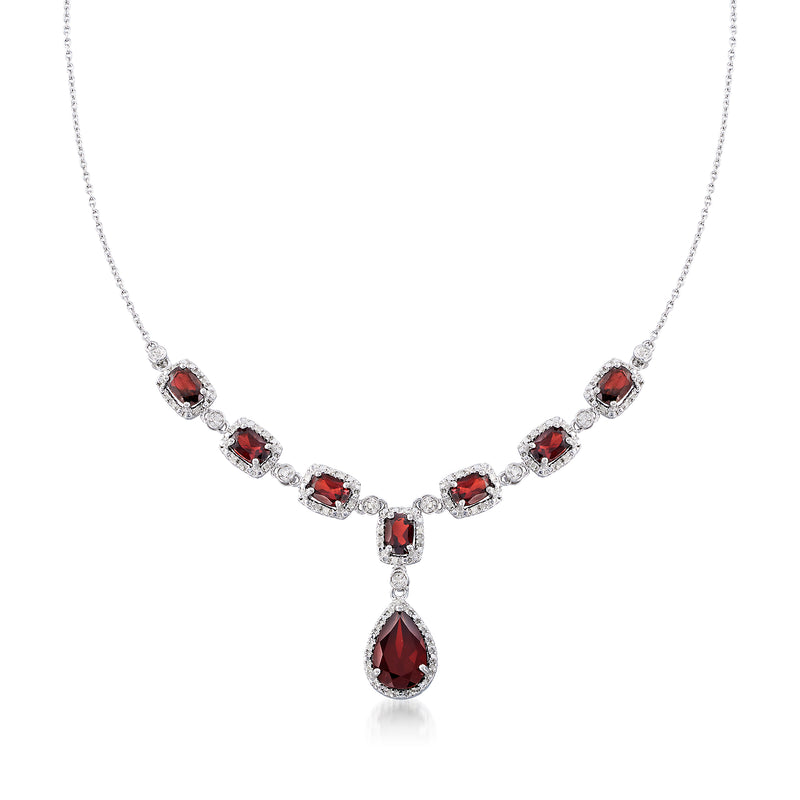 Sterling silver necklace with red garnet stations and diamond accents, teardrop pendant