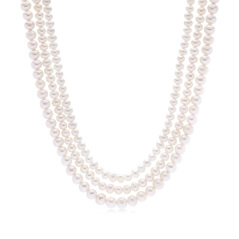 Cultured pearl three-strand necklace with round white pearls, no clasp visible