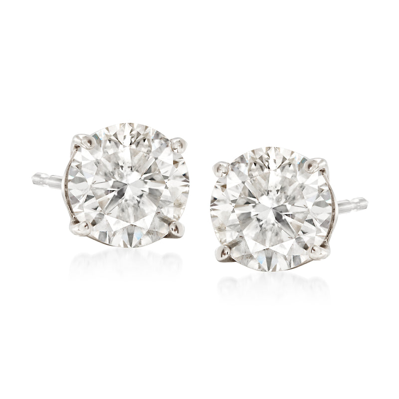 Diamond stud earrings in 14kt white gold with two round prong-set diamonds, sparkle.