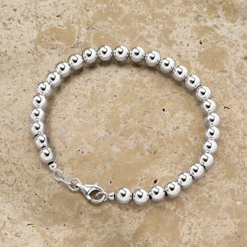 Sterling silver beaded bracelet with round beads and spring-ring clasp detail