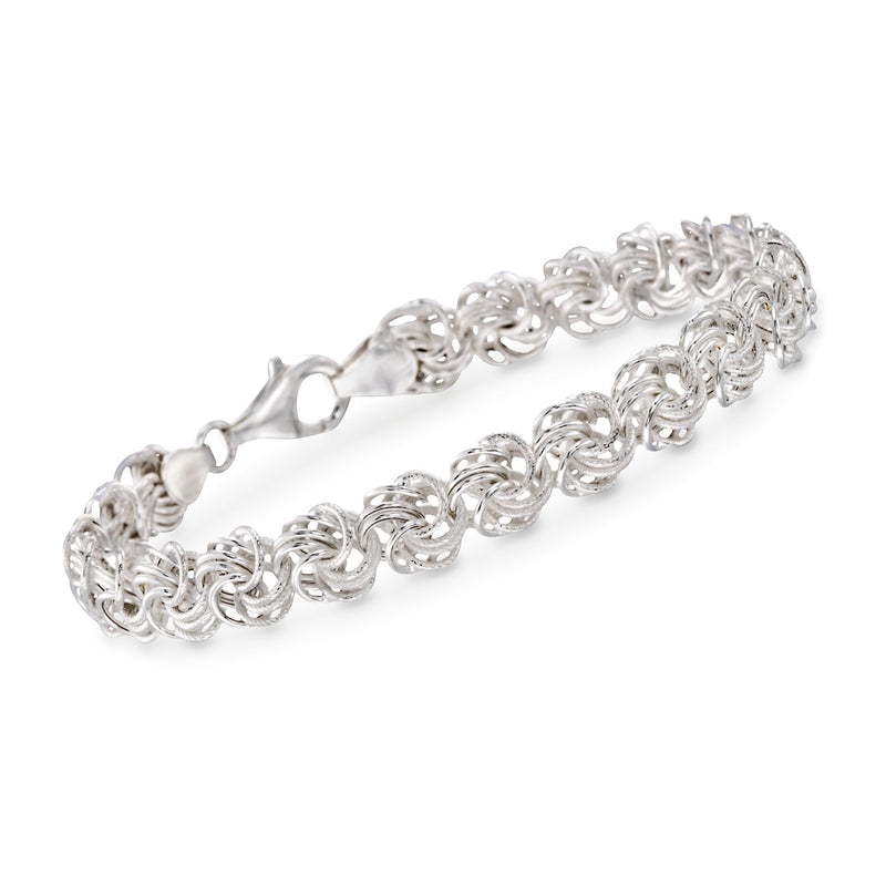 Sterling silver rosette link bracelet with small curled round link clusters