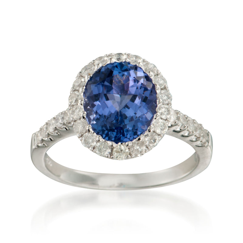 14kt white gold tanzanite and diamond ring with oval blue center and halo