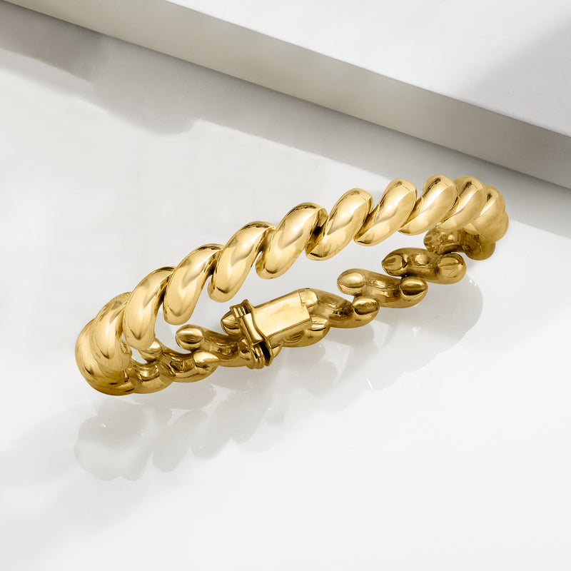 Gold over sterling silver curb-link bracelet with round toggle clasp, side view