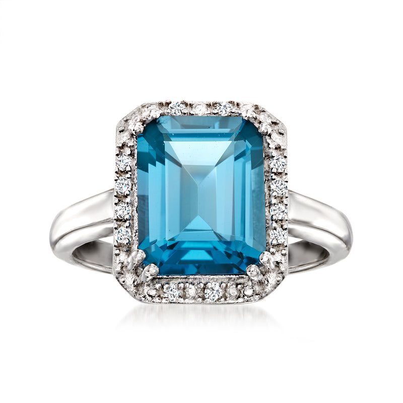 Sterling silver ring with large blue topaz center and diamond halo, cushion cut