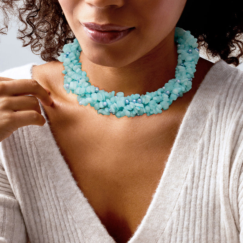 Blue beaded torsade necklace on model, layered strands with pearl accents
