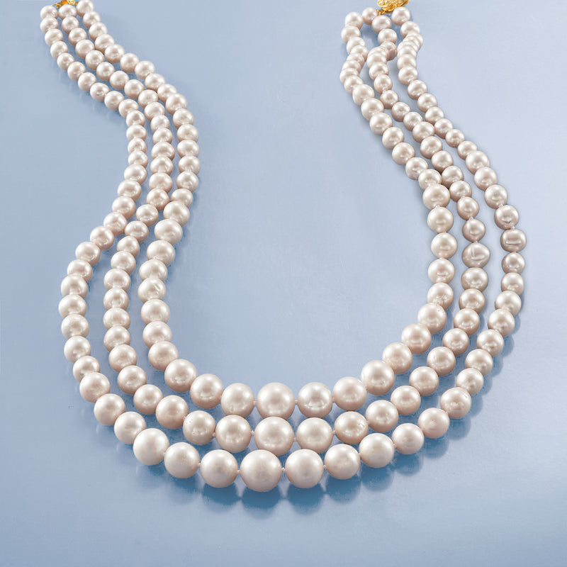 Graduated cultured pearl three-strand necklace with layered rows of white pearls