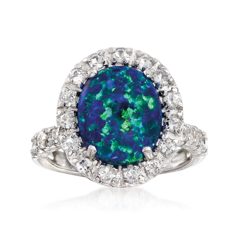 Sterling silver ring with blue-green opal center and clear stone halo