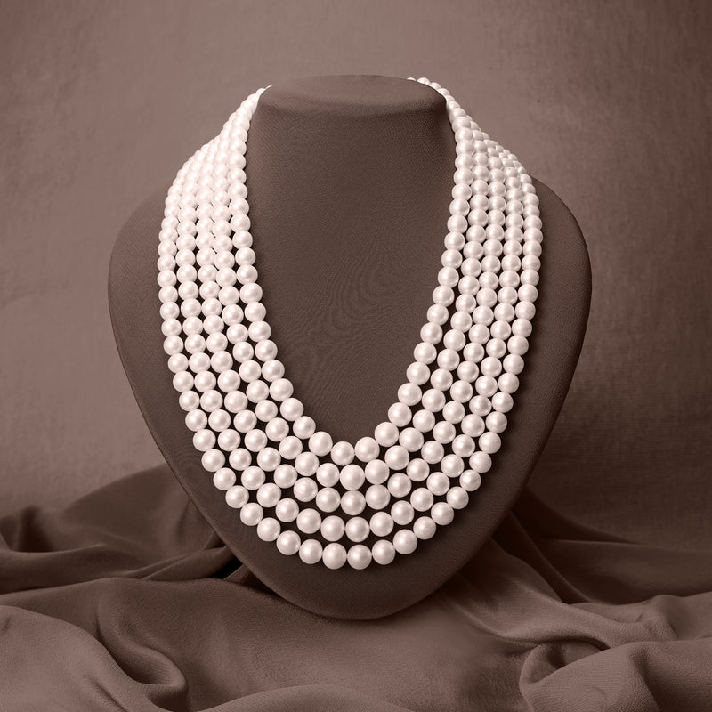 Five-strand cultured pearl necklace shown on a bust with layered strands