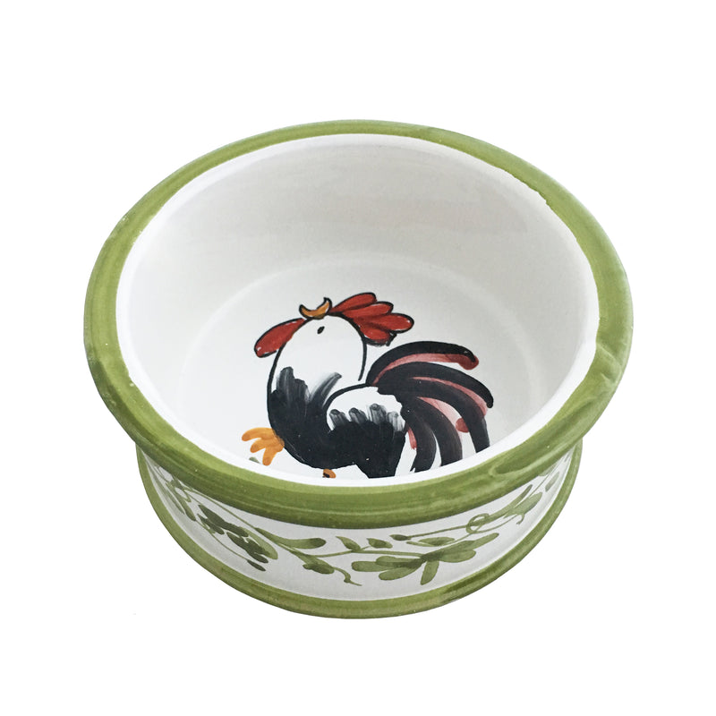 Ceramic pet bowl with rooster graphic and green rim, white interior.