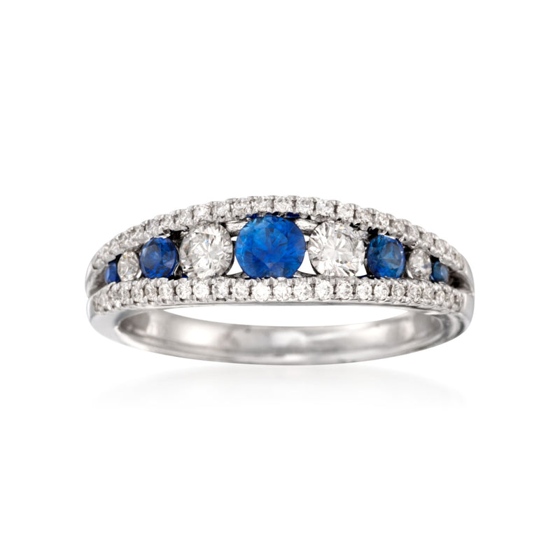 18kt white gold ring with blue sapphire center, flanked by small diamonds