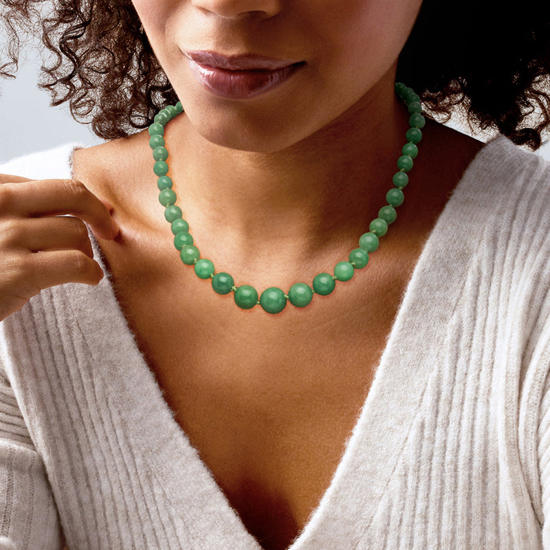 Green jade bead necklace on neckline, short strand of round beads