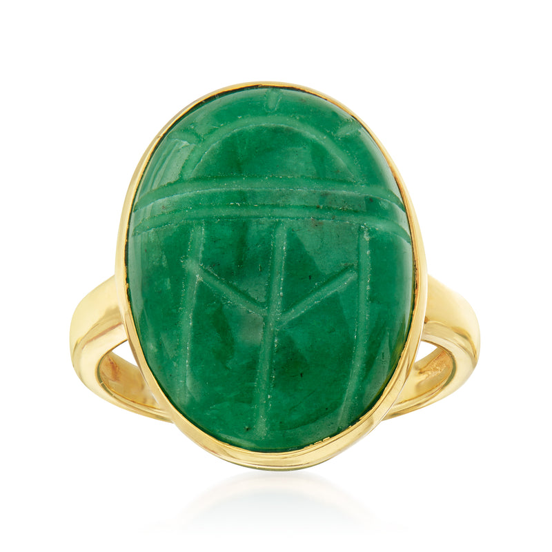 Emerald green oval scarab ring with gold-tone bezel and curved band