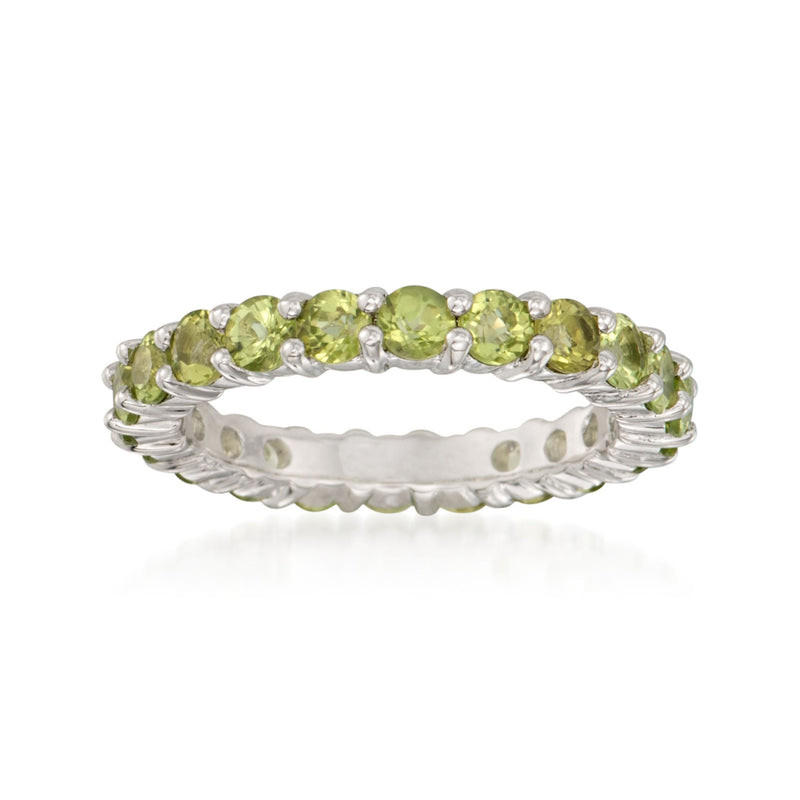 Sterling silver eternity band with oval peridot-green stones and small clear accents