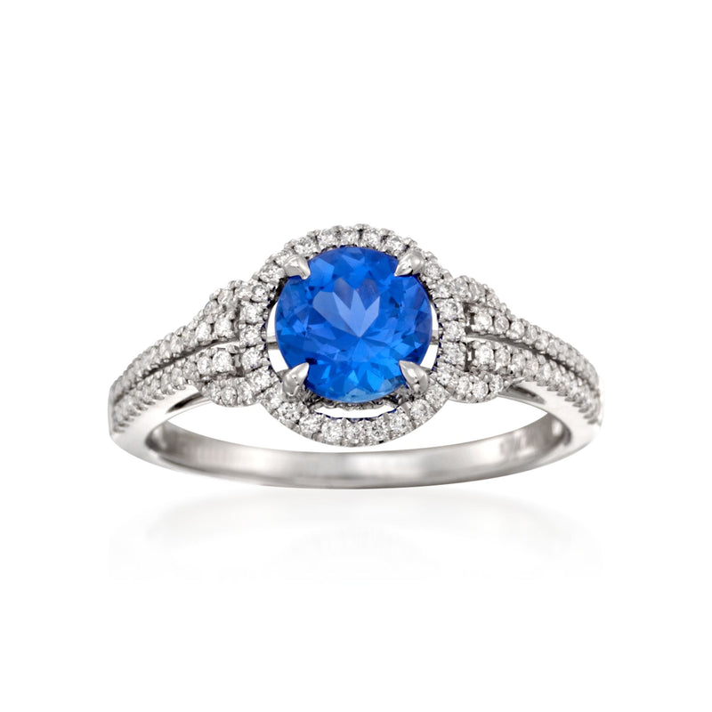 18k white gold tanzanite and diamond ring with round blue center stone and halo