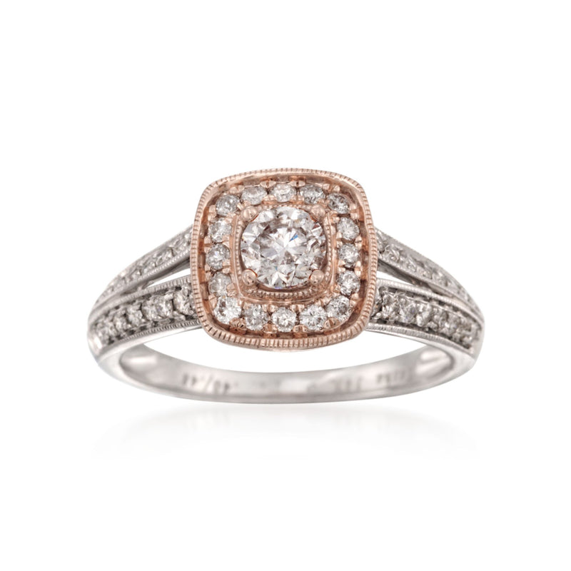 Two-tone 14kt gold diamond engagement ring with oval center and halo