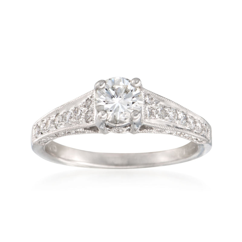 18kt white gold diamond ring with round center stone and pave side details
