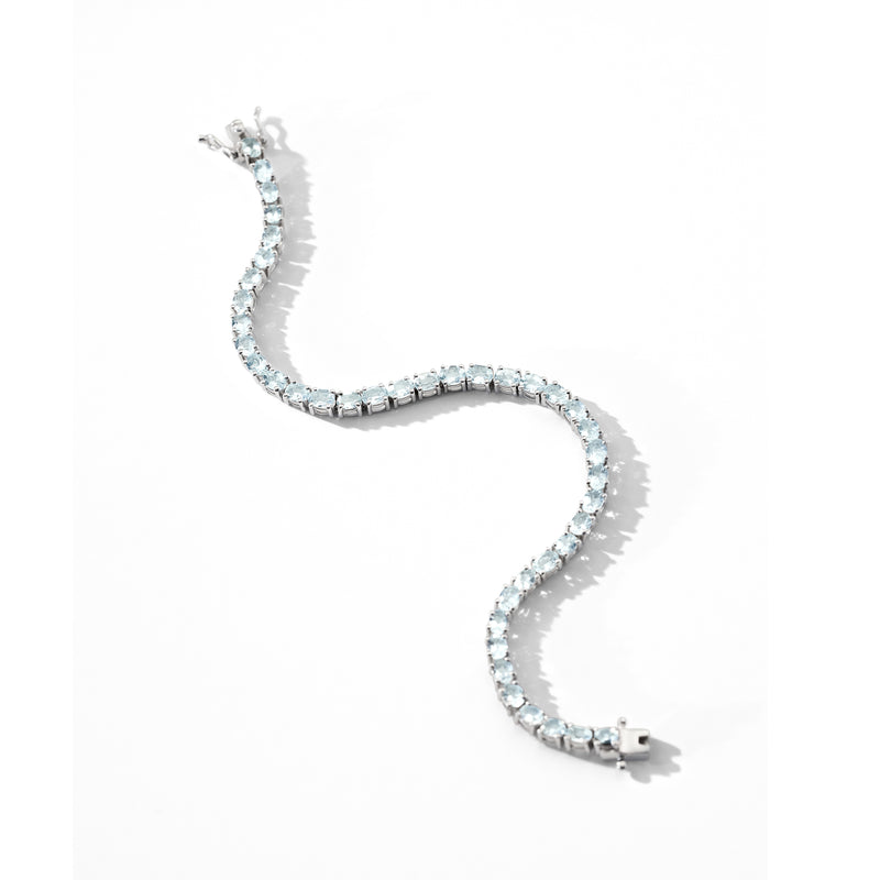 Sterling silver tennis bracelet with light blue aquamarine stones, clasp end