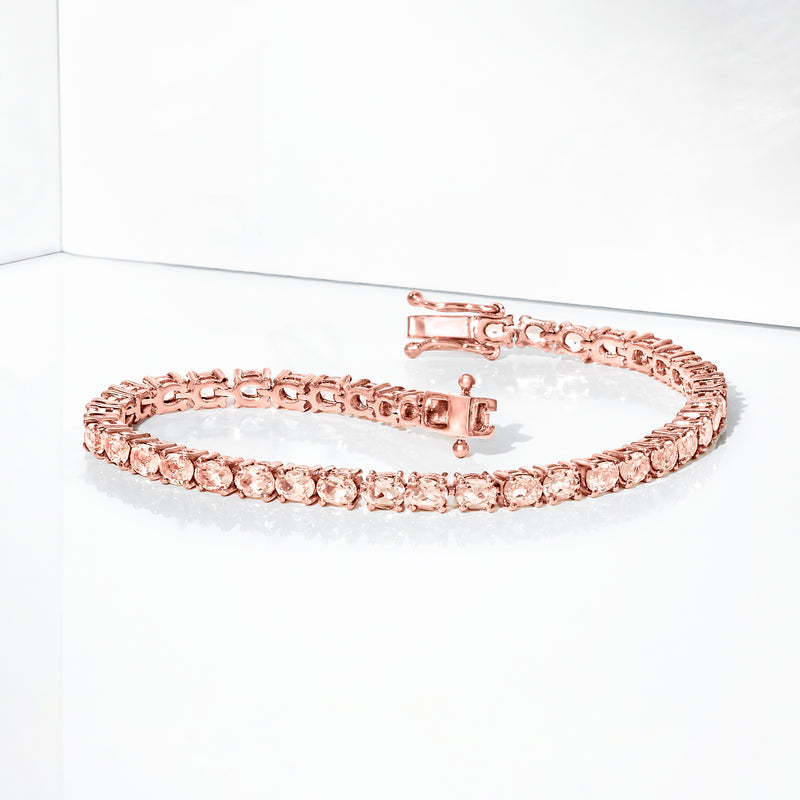 Rose gold tennis bracelet with pink stones and visible clasp at side