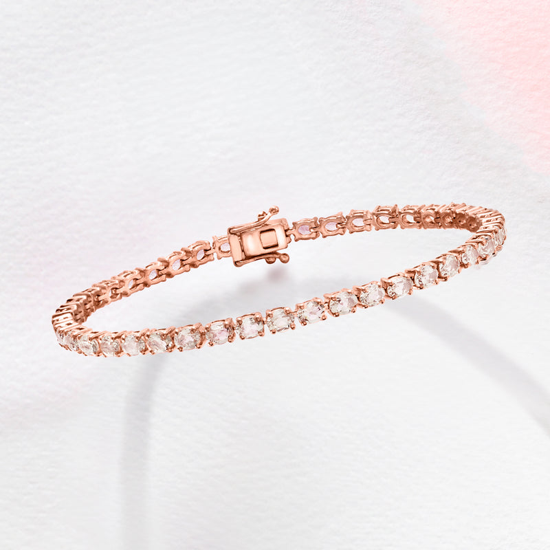 Rose gold tennis bracelet with pink gemstone row and square clasp detail