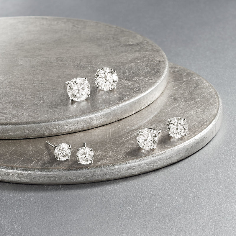 Six sterling silver CZ stud earrings with round clear stones