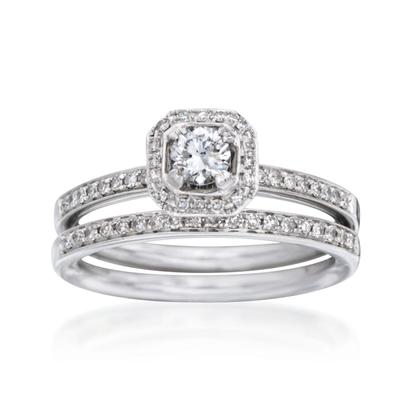 Diamond bridal set in 14kt white gold with cushion halo and matching bands