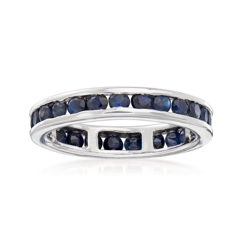 Sterling silver eternity band with channel-set dark blue sapphires, slim oval profile