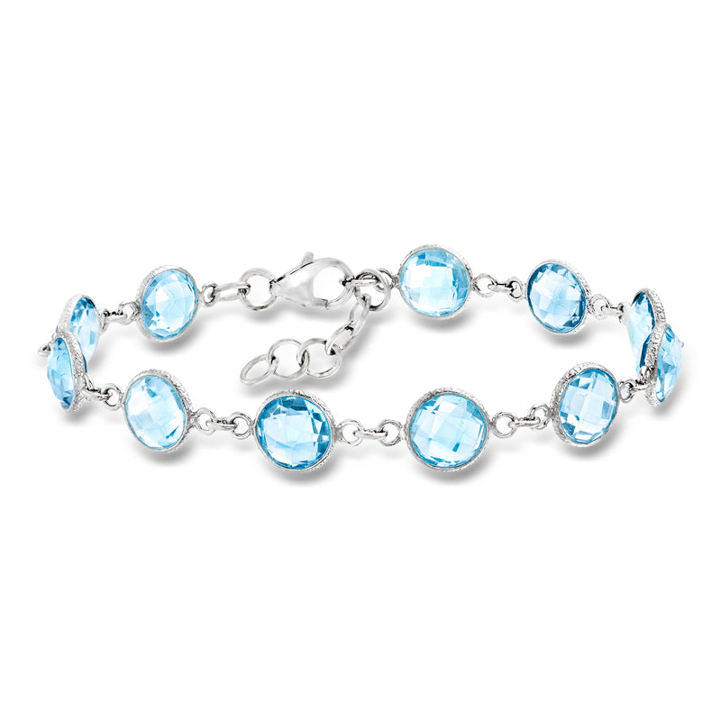 Sky blue topaz bracelet in sterling silver with oval faceted stones, link chain.