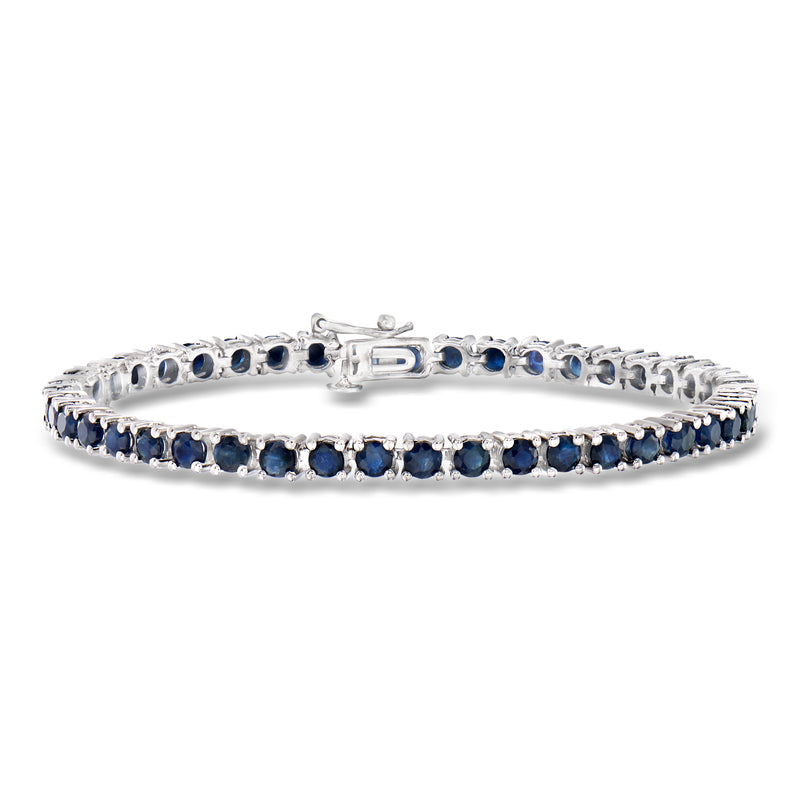 Sterling silver tennis bracelet with oval blue sapphire stones, flexible row setting