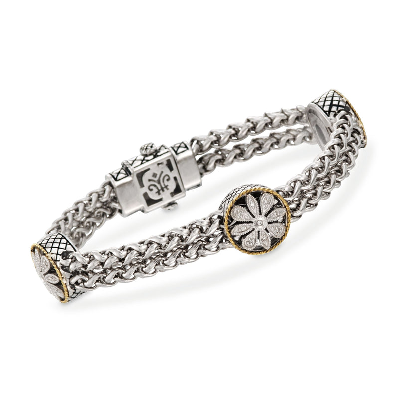 Two-tone floral station bracelet with silver chain and round floral clasp detail