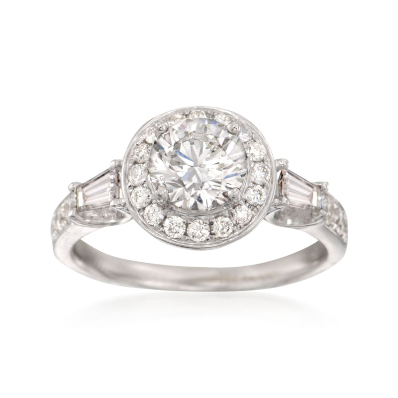White gold diamond halo engagement ring with round center stone and side baguette accents