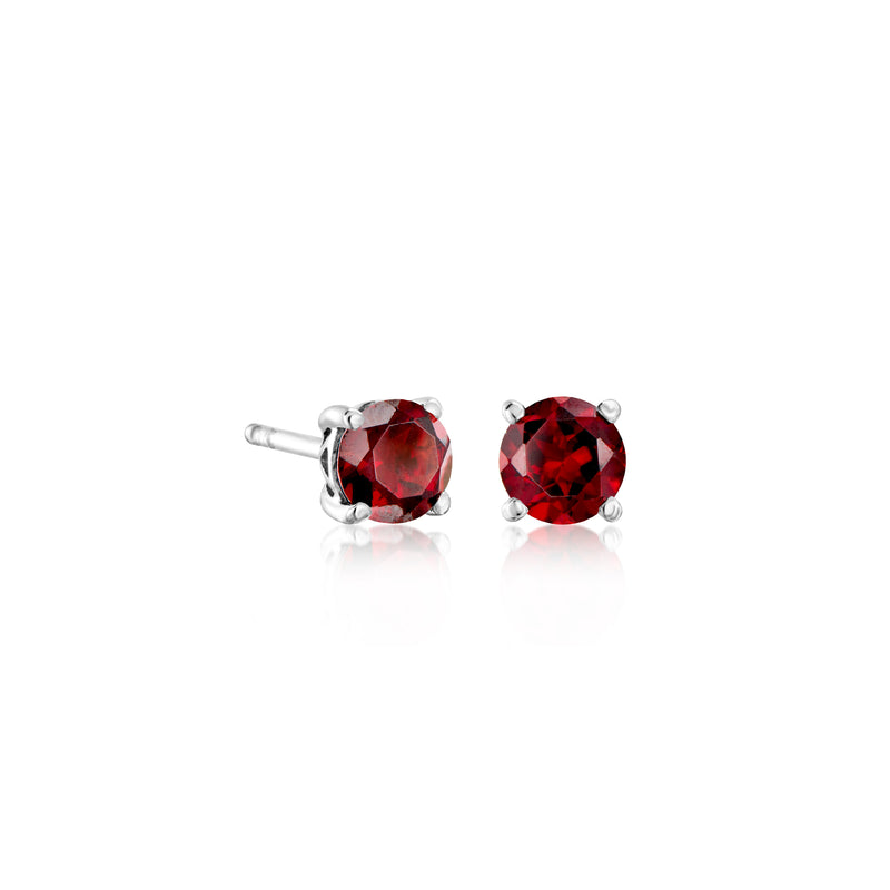 Pair of round red gemstone stud earrings with sterling silver prongs