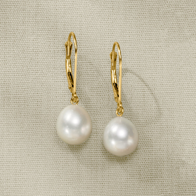 Cultured pearl drop earrings in 14kt yellow gold with leverback hooks, close-up