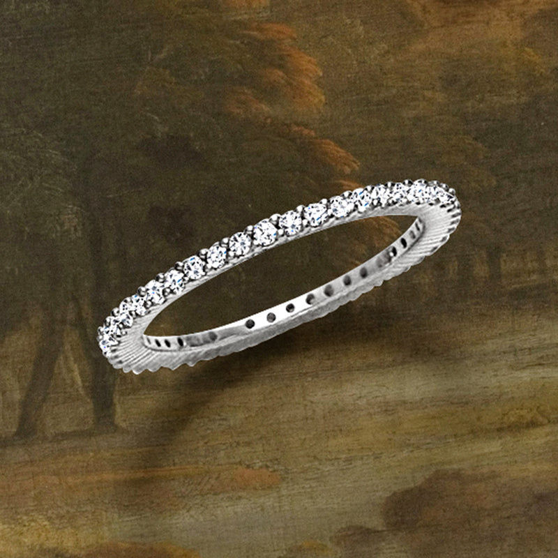 14kt white gold diamond eternity band with channel-set stones, angled side view
