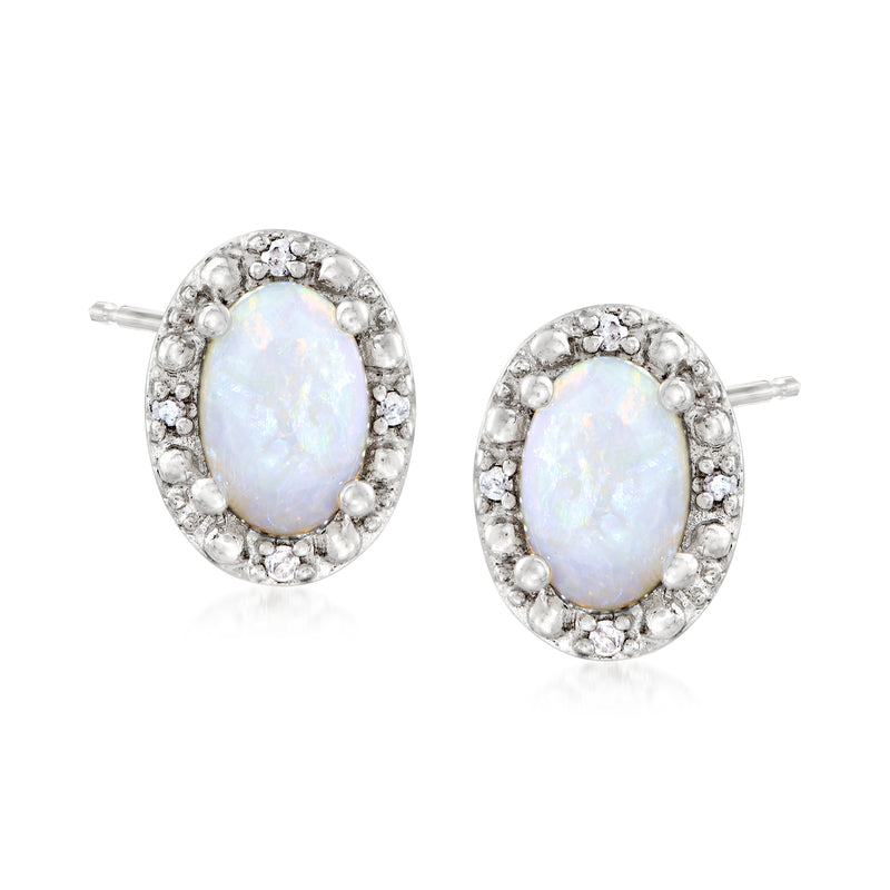 Sterling silver opal stud earrings with oval opal center and diamond halo, post backs