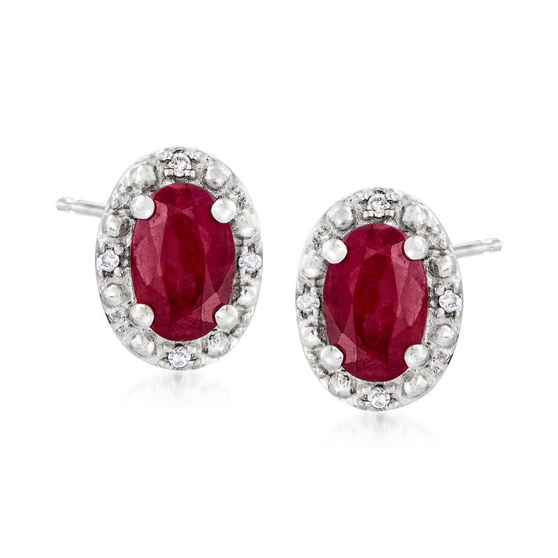 Oval ruby stud earrings in sterling silver with diamond accents, post backs