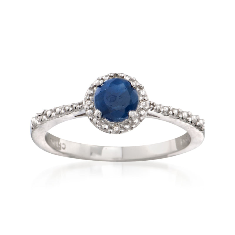 Sterling silver ring with round blue sapphire center and diamond-like halo accents