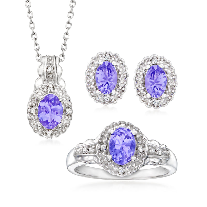 Sterling silver jewelry set with oval tanzanite and white topaz stones: pendant, earrings, ring