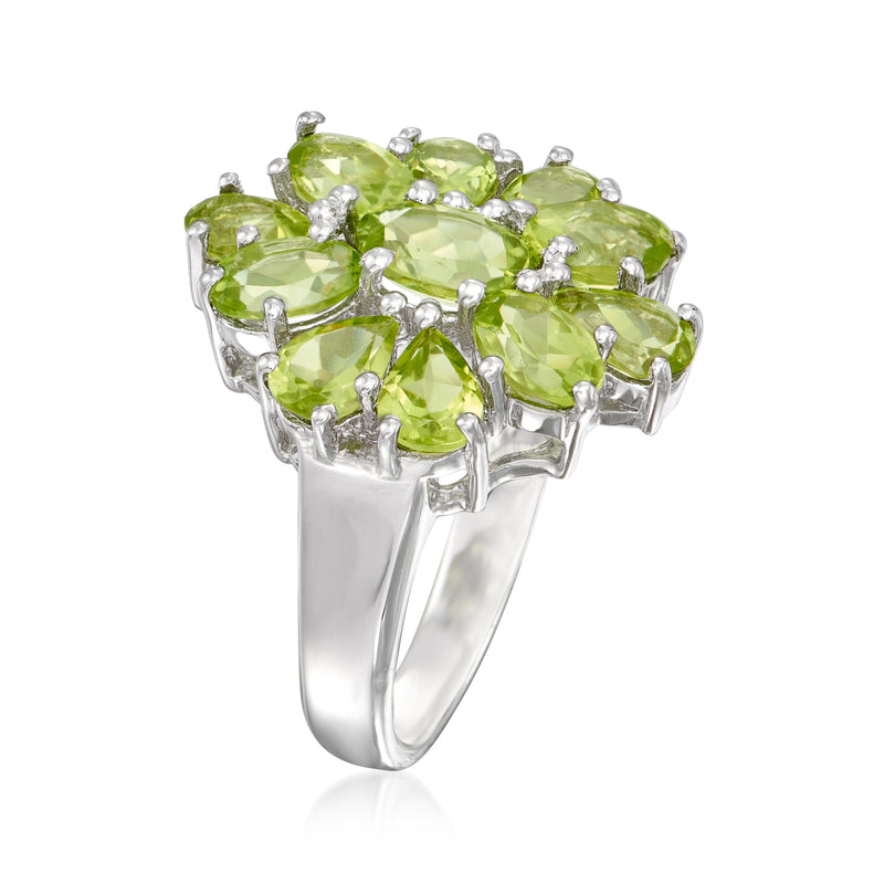 Sterling silver peridot cluster ring side view with faceted green stones in prong settings