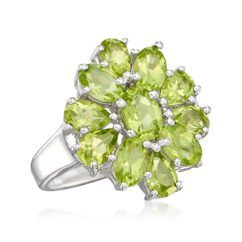 Sterling silver peridot cluster ring angled view featuring multiple oval green gemstones