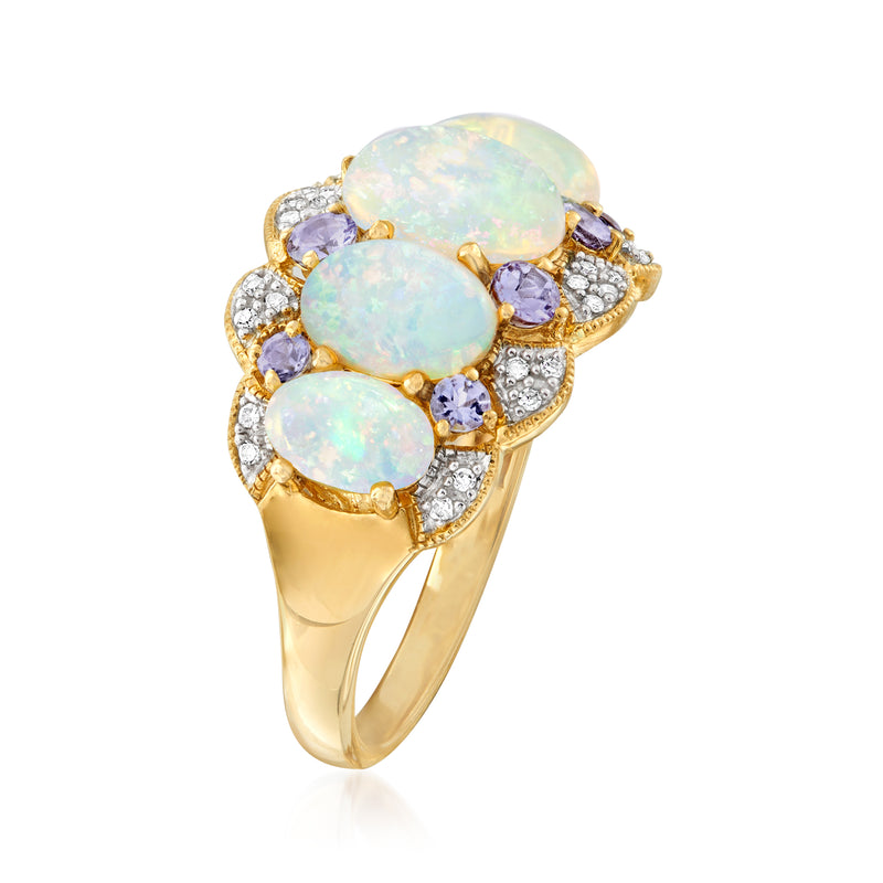 14kt yellow gold ring with three opal-like ovals, purple gemstones, and diamond side details