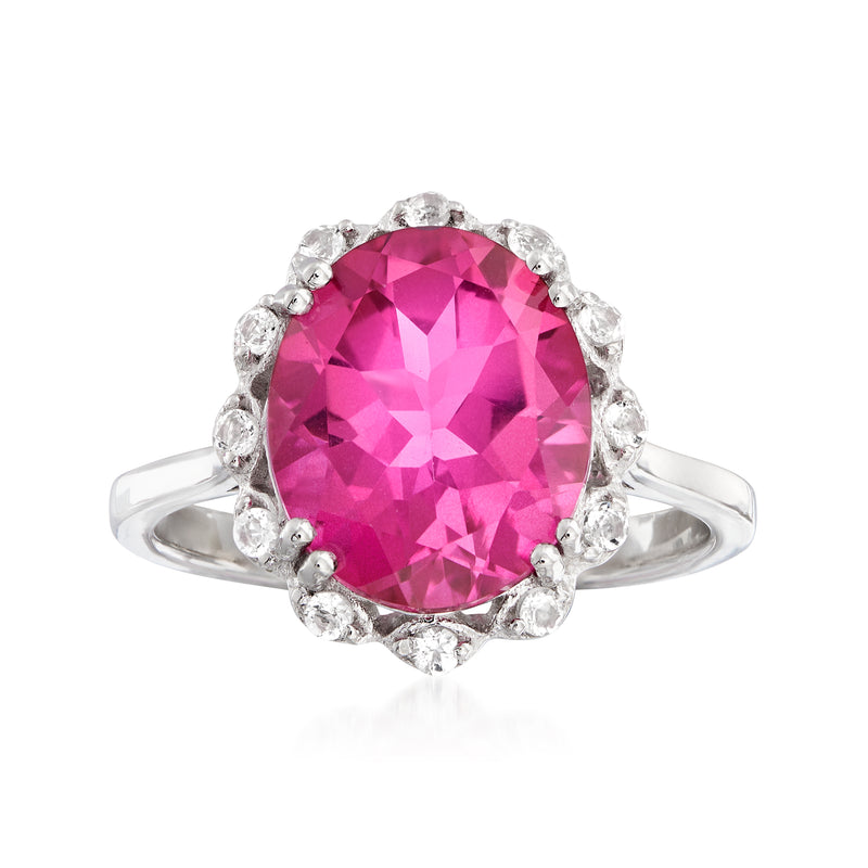 Sterling silver ring with large pink topaz center and white gemstone halo